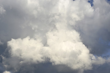 Beautiful view of white, Cumulus, clouds in the stormy sky.