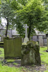 Grave stones and green trees at the  Kirk of Saint Nicholas Uniting.