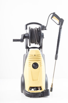 Yellow high pressure washer on white background