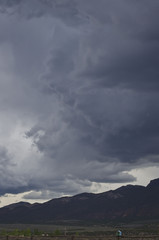 The dark large covering storm clouds in the browns park sky.