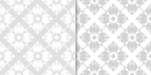 Light gray floral ornamental designs. Set of seamless patterns