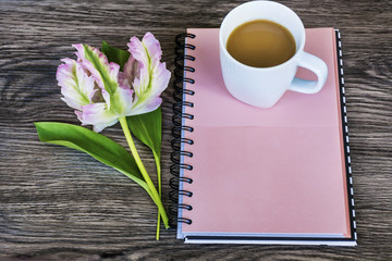 Notebook,Fresh Flower and  Cup of Coffee .Spring Morning Concept with Copy Space 