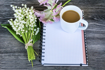 Obraz na płótnie Canvas Notebook,Fresh Flower and Cup of Coffee .Spring Morning Concept with Copy Space 