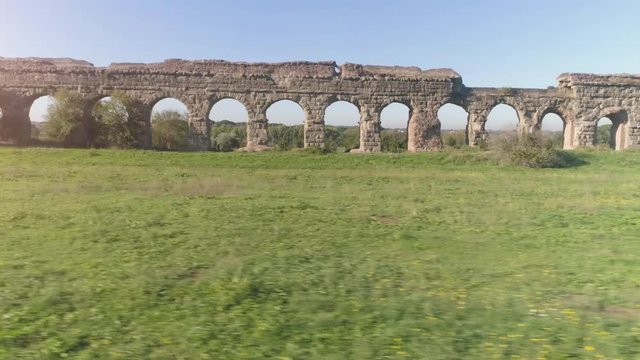 Aerial view of famous ancient roman aqueduct claudio landmark in parco degli acquedotti in rome drone slow motion dolly
