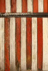 Aged wooden boards painted in red and white