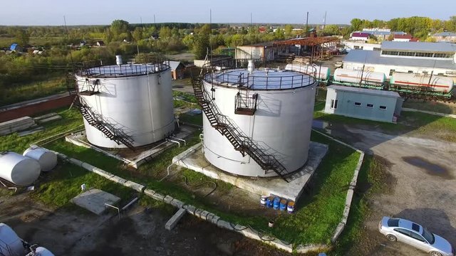Aerial top view oil storage tanks. Stock. Top view of the large oil tanks
