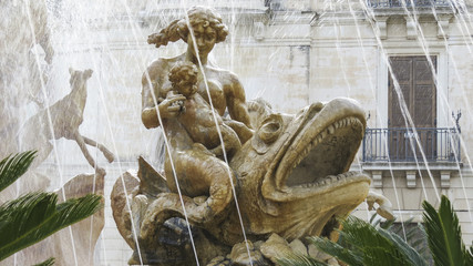 Famous Artemis (Diana) Fountain on Archimedes Square on the Ortygia isle, Sicily, Italy