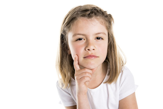Portrait of a cute 7 years old girl Isolated over white background pensive