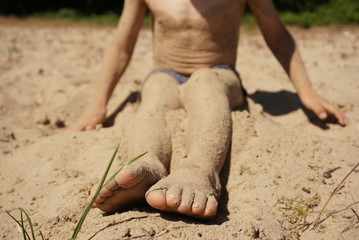 Child Feet In Sand At Beach