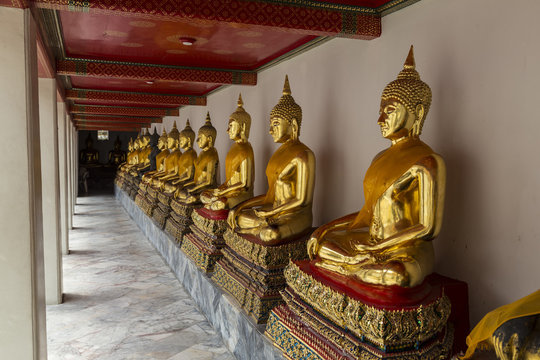 Gilded Buddha statues in Wat Pho ( Temple of the Reclining Buddha ). Bangkok. Thailand.
