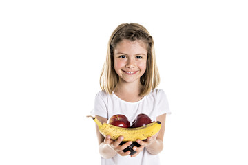 Portrait of a cute 7 years old girl Isolated over white background with apple, banana and avocado