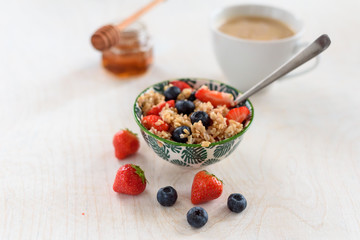 Healthy Homemade Oatmeal with strawberries and blueberries for Breakfast