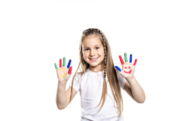 smiling girl with the palms painted by a paint. Isolated on white background