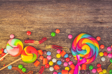 Colorful candies on wood