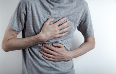 Heartburn in a man. Acid in the esophagus. 