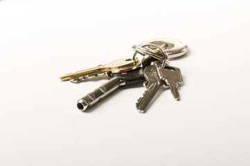 keys and a house of bricks in the background