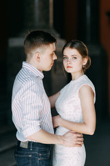 Beautiful young couple in the Park on a Sunny day, loving and happy. Walk and laugh together. Pre-wedding shooting in nature. Elegant style in clothes like celebrities