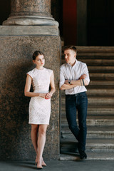 Beautiful young couple in the Park on a Sunny day, loving and happy. Walk and laugh together. Pre-wedding shooting in nature. Elegant style in clothes like celebrities