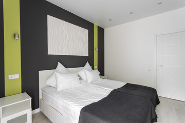 Fototapeta na wymiar daylight morning. Hotel standart room. modern bedroom with white pillows. simple and stylish interior.