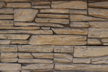 gray brown uneven brick wall pattern