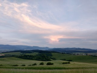 Fototapeta premium Sunset on meadow with hills and tree. Slovakia 
