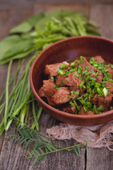 meat in a clay plate