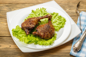 Fried duck legs, ready to serve. The finished dish for use in the restaurant menu.