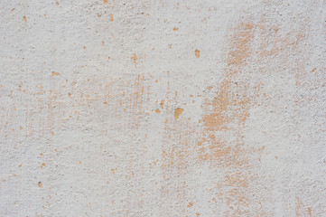 beige-white Textured background of multi-layer flaking paint on the wall. Grunge texture with a deep pattern