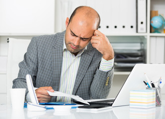 Naklejka premium Sad businessman thinking about work