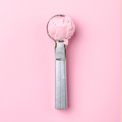 Tasty strawberry ice cream on vintage metal spoon
