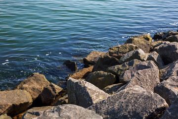 granite stone lie on the seashore.