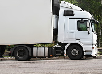 lorries parked up outside a company's car parking area