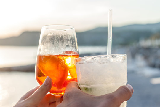 cheers two glasses with cocktails