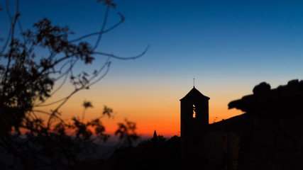 View of the Romanesque church of Santa Maria de Siurana at sunset in Siurana de Prades, Tarragona, Spain. Copy space for text.