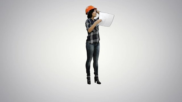 Asian engineer woman with blueprints and orange helmet on white background