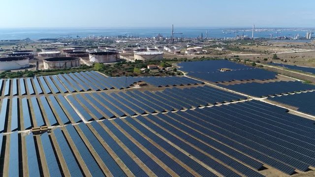 Aerial bird view footage of solar park also known as photovoltaic power station this is large-scale photovoltaic system designed for the supply of merchant power into the electricity grid 4k quality