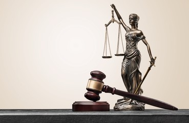 Justice Scales and wooden gavel on tble