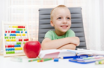 Preschooler, student doing homework at the desk