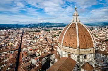 Fototapeta na wymiar Dome of the cathedral of Florence, by Brunelleschi, and Florence panorama city skyline, Florence, Italy