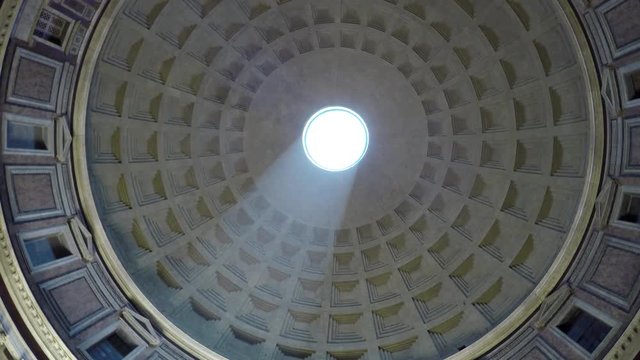 Rome Italy Pantheon dome footage panning around the oculus showing the sky and the dome roof  this concrete coffered dome is poured into moulds the building is a popular tourist attraction in Rome 4k
