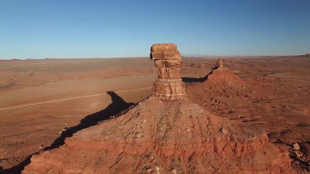 Aerial drone footage of butte and sandstone monument in Utah (backward view 3 of 3)