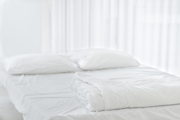 Fototapeta na wymiar White clean pillow natural fabric cotton style on the white bed