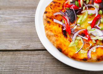 Focaccia Italian bread with red onion, scallion and bell pepper, delicious vegan food, Italian cuisine, restaurant menu photo concept