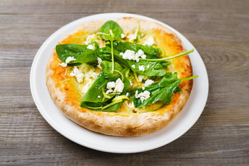 Focaccia Italian bread with cottage cheese and spinach, delicious vegan food, Italian cuisine, restaurant menu photo concept