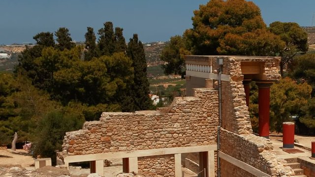 Establishing shot of the Minoan Palace of Knossos in Heraklion, Crete, Greece and surrounding mountains