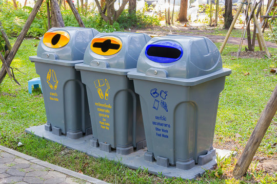 Plastic bin with text in the garden