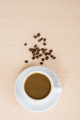 Close up coffe beans in the cop of coffee drop on the coffee beans.