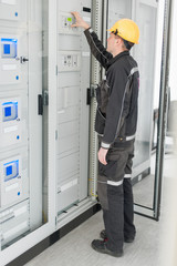 Engineer commissioning bay control unit. Engineering department