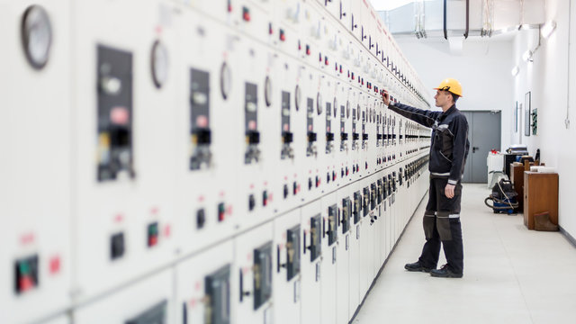 Engineer commissioning bay control unit. Engineering department