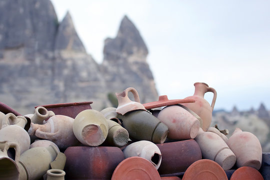 stacked together broken clay pots